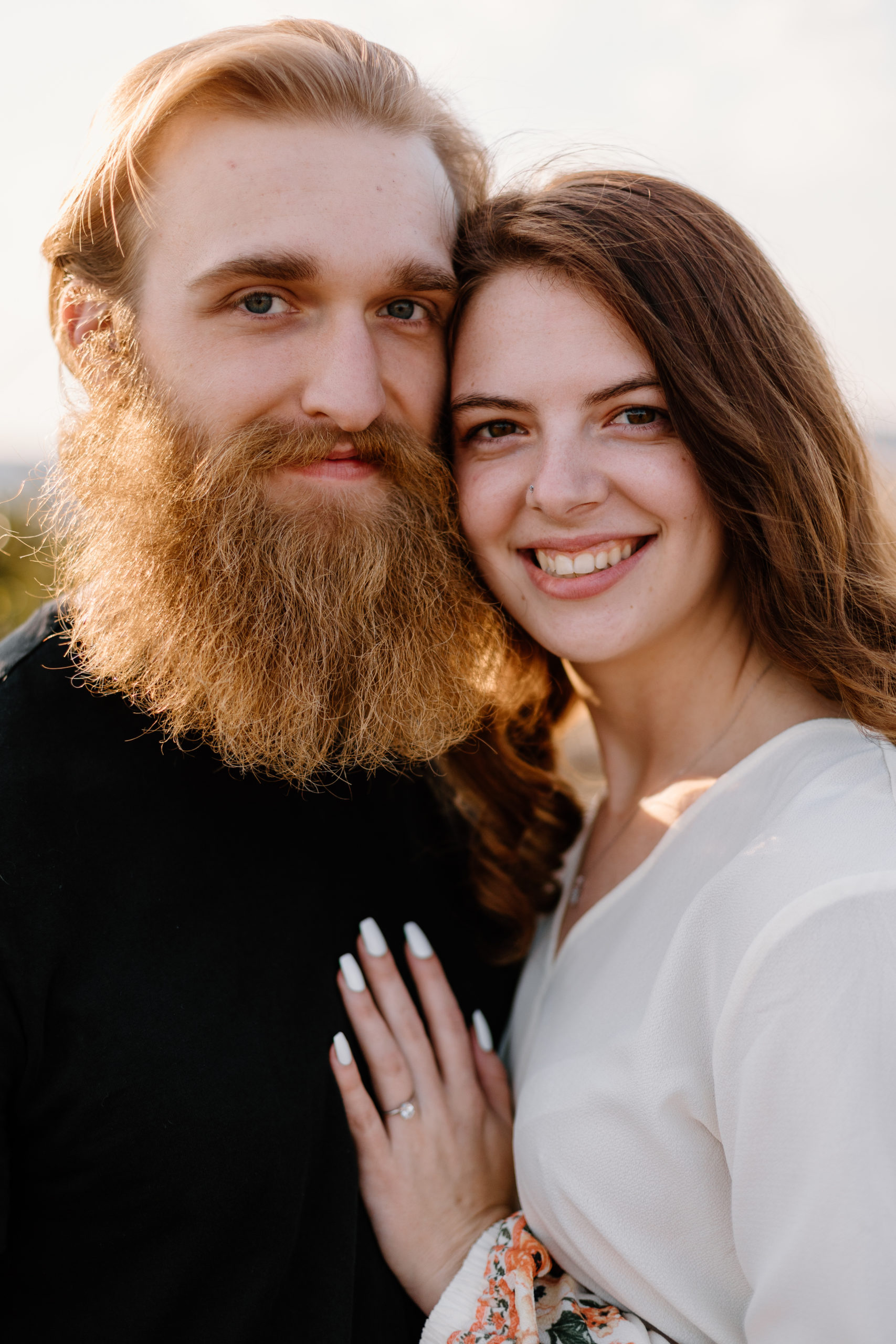 beautiful couple pose together during their Georgia engagement photos