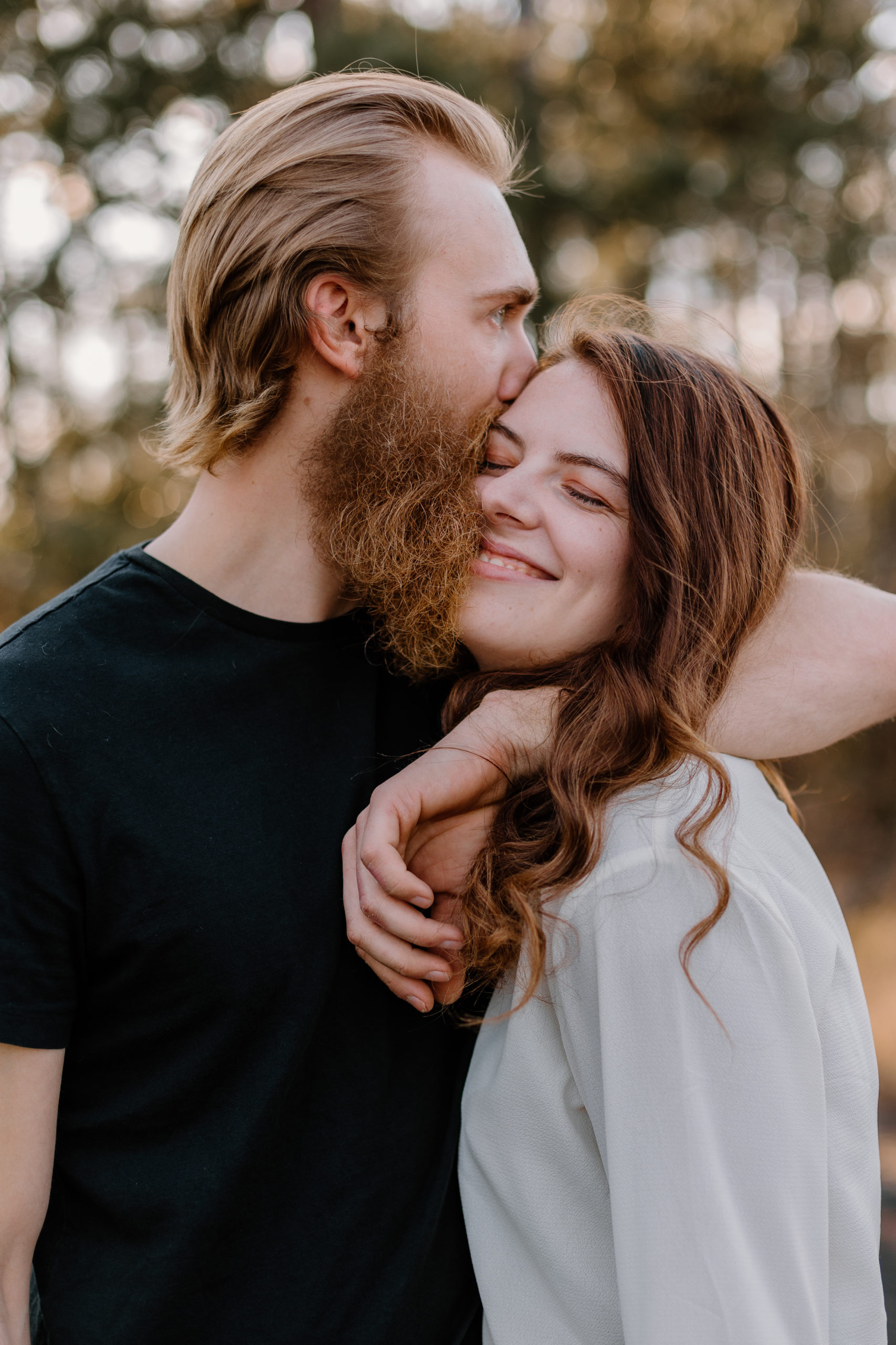 beautiful couple pose together during their Georgia engagement photoshoot