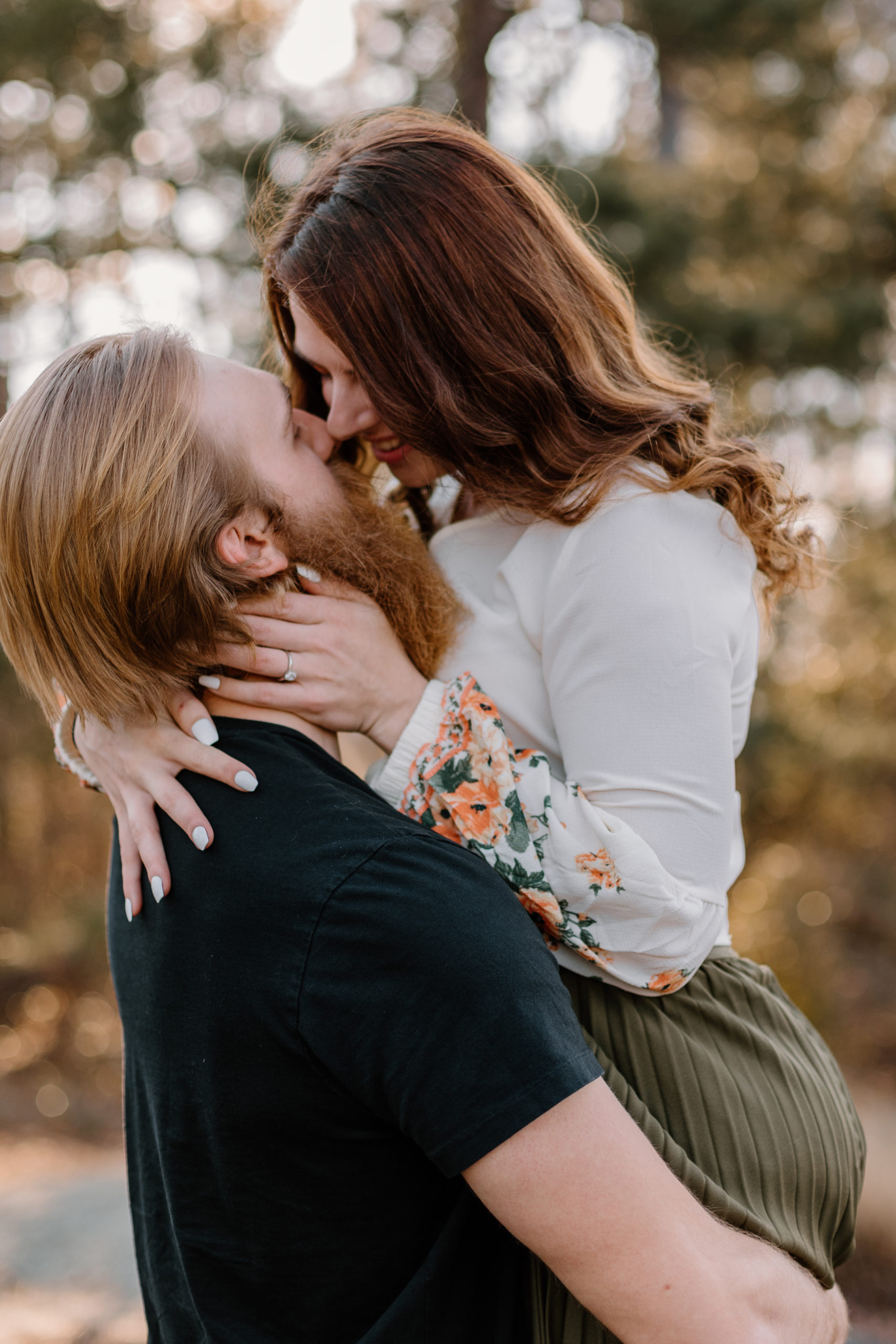 beautiful couple pose together during their Georgia engagement photos