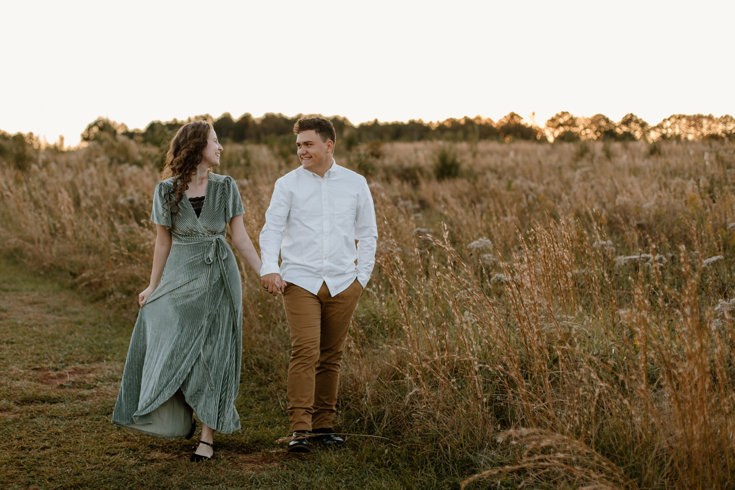 Stunning couple pose together during their golden hour engagement photoshoot in Georgia