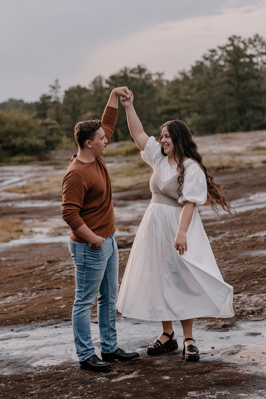 Adventure engagement session with cute couple during golden hour on Arabia Mountain. 