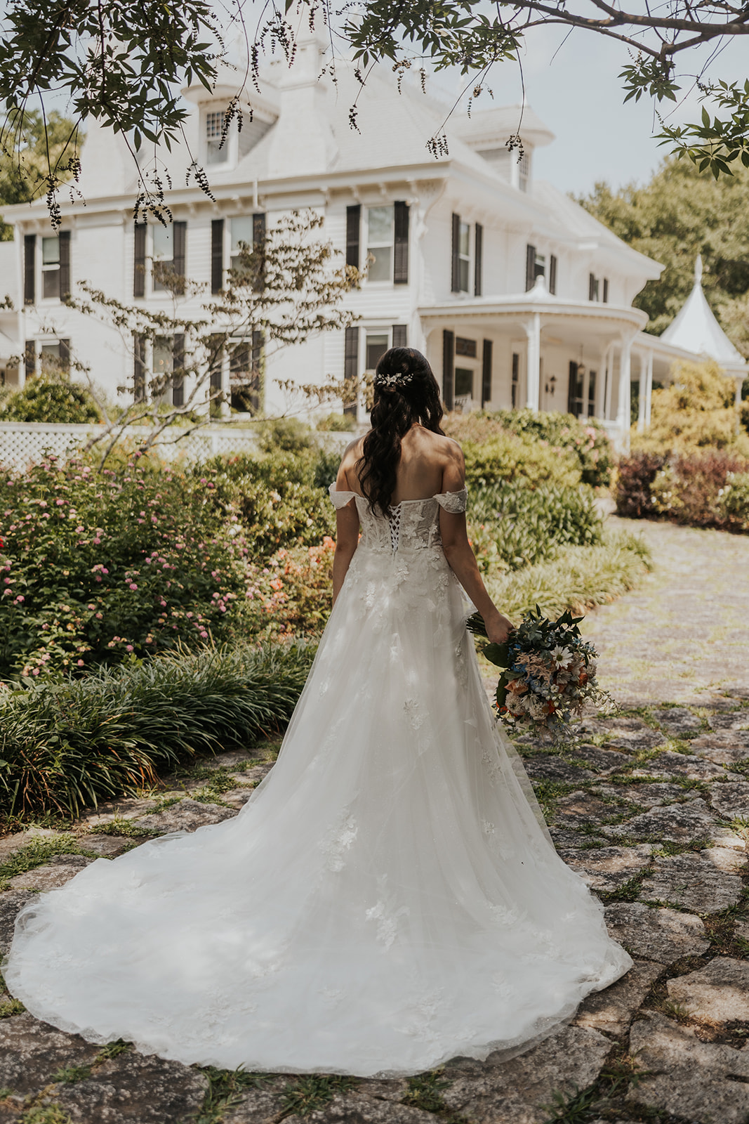 Stunning bride poses outside Wildflower 301 in Georgia