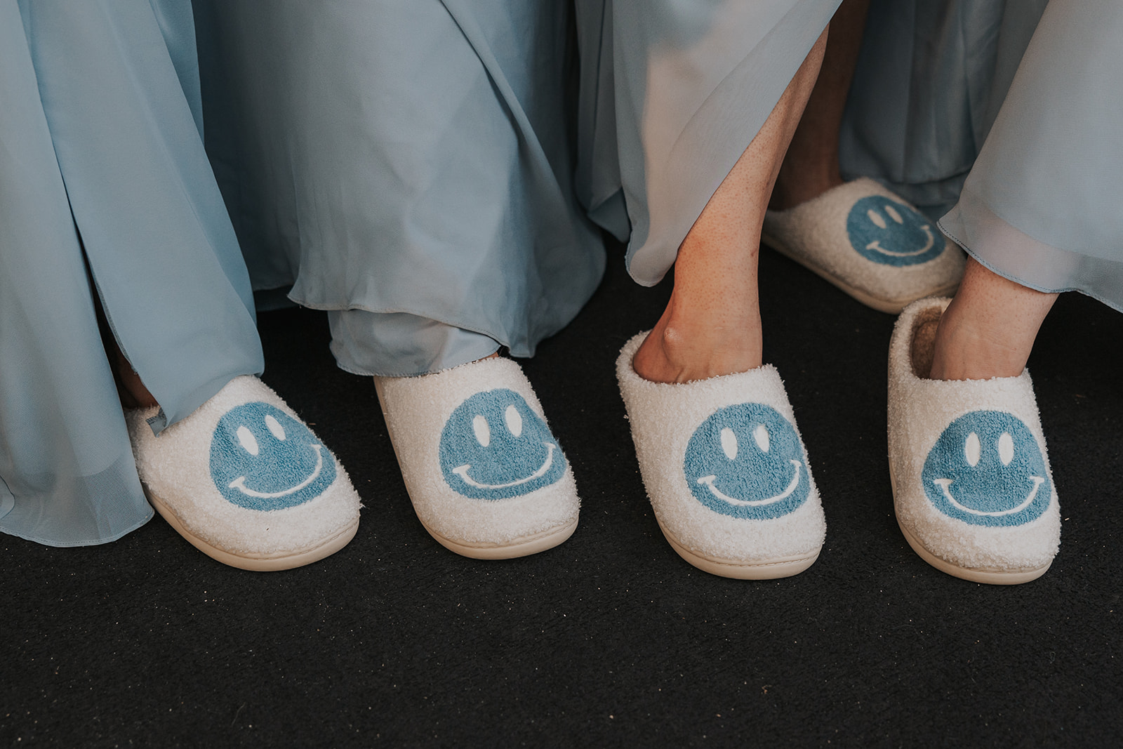 A picture of bridesmaids smiley face slippers