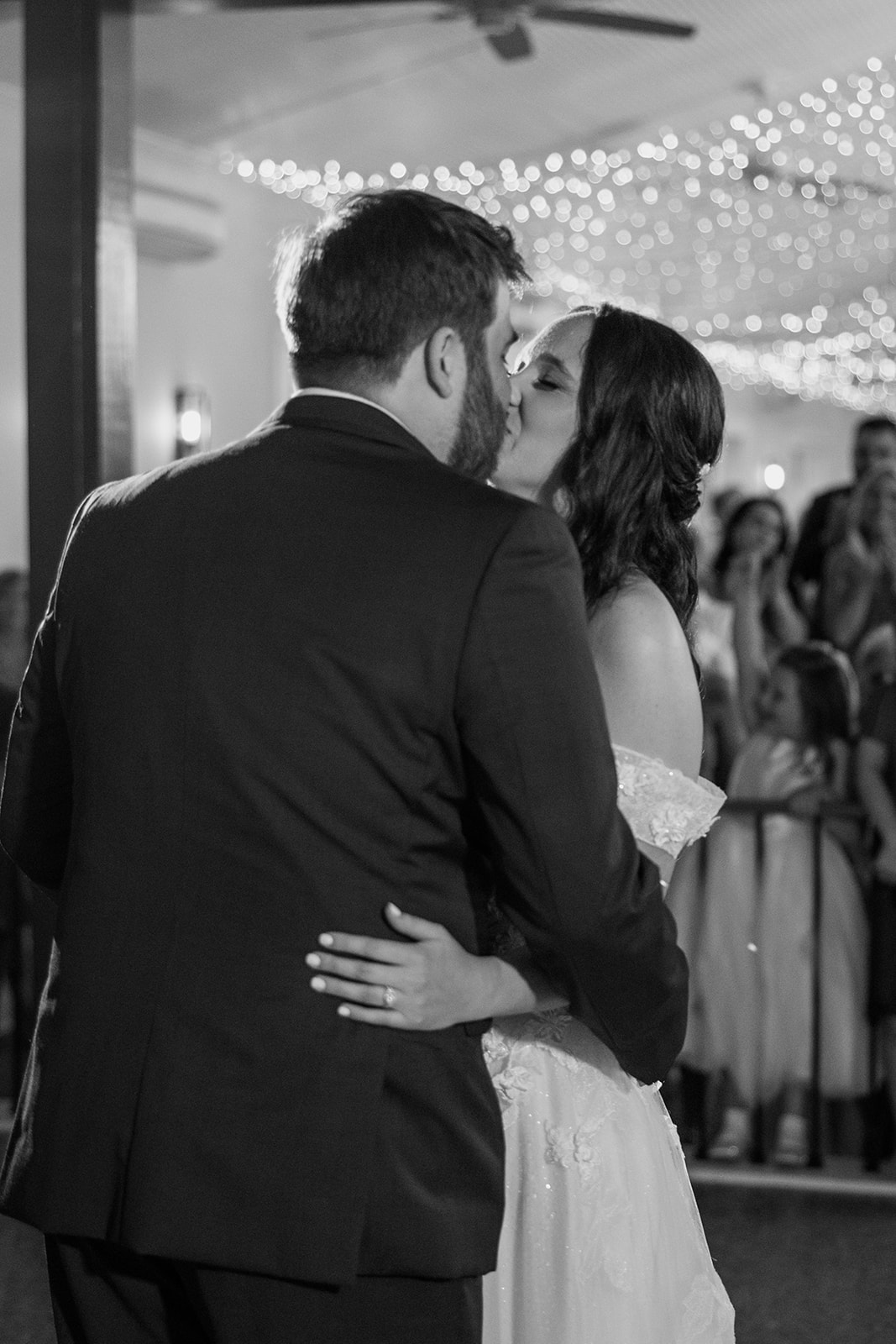 Bride and groom share a kiss on the dance floor at their sentimental Georgia wedding