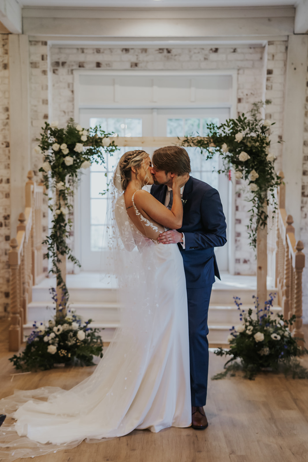 Stunning bride and groom share a kiss inside their Georgia wedding venue
