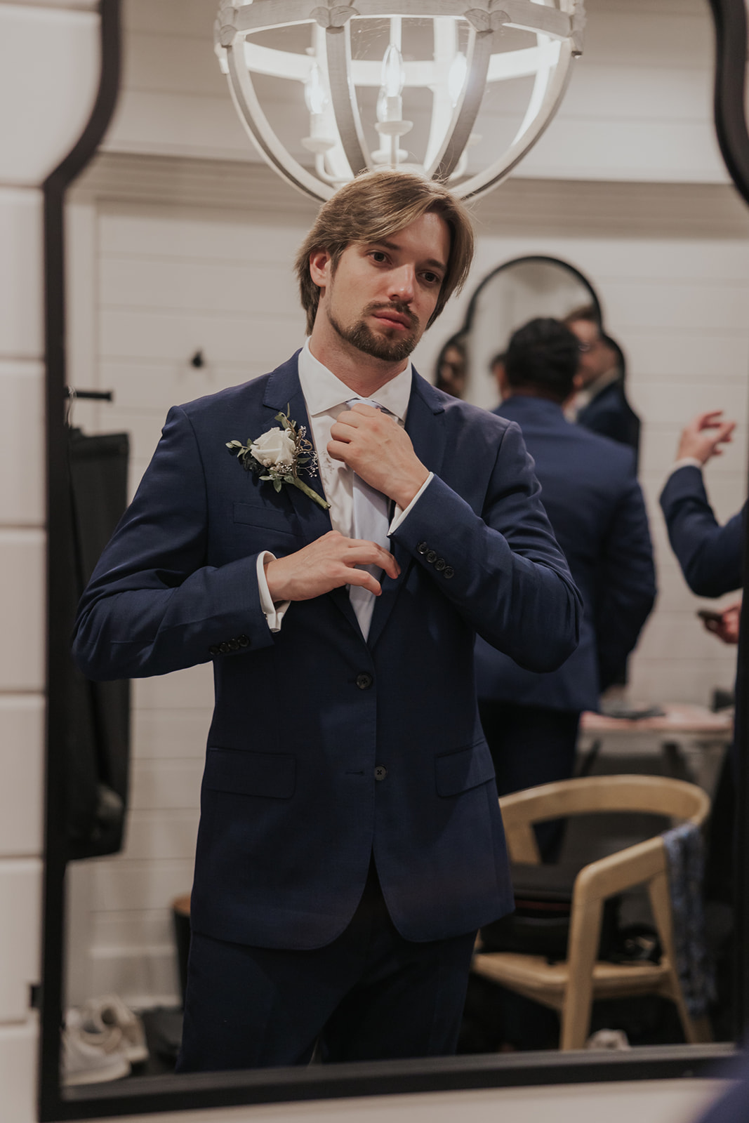 Handsome groom adds his final touches as he prepares for his dreamy Georgia wedding