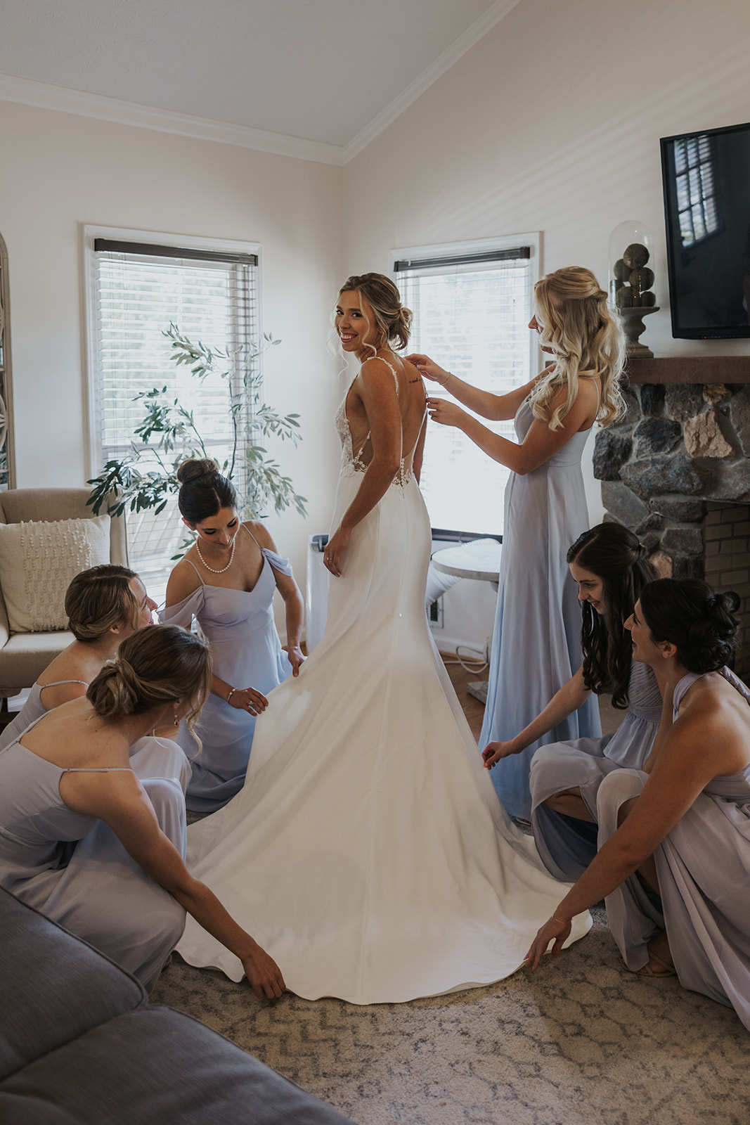 Stunning bride poses with her bridesmaids before her Georgia barn wedding