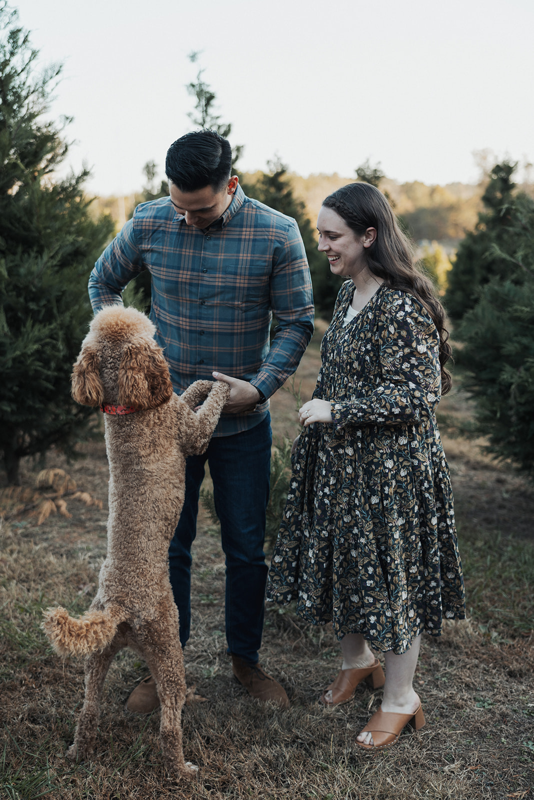Stunning couple pose together with their dog