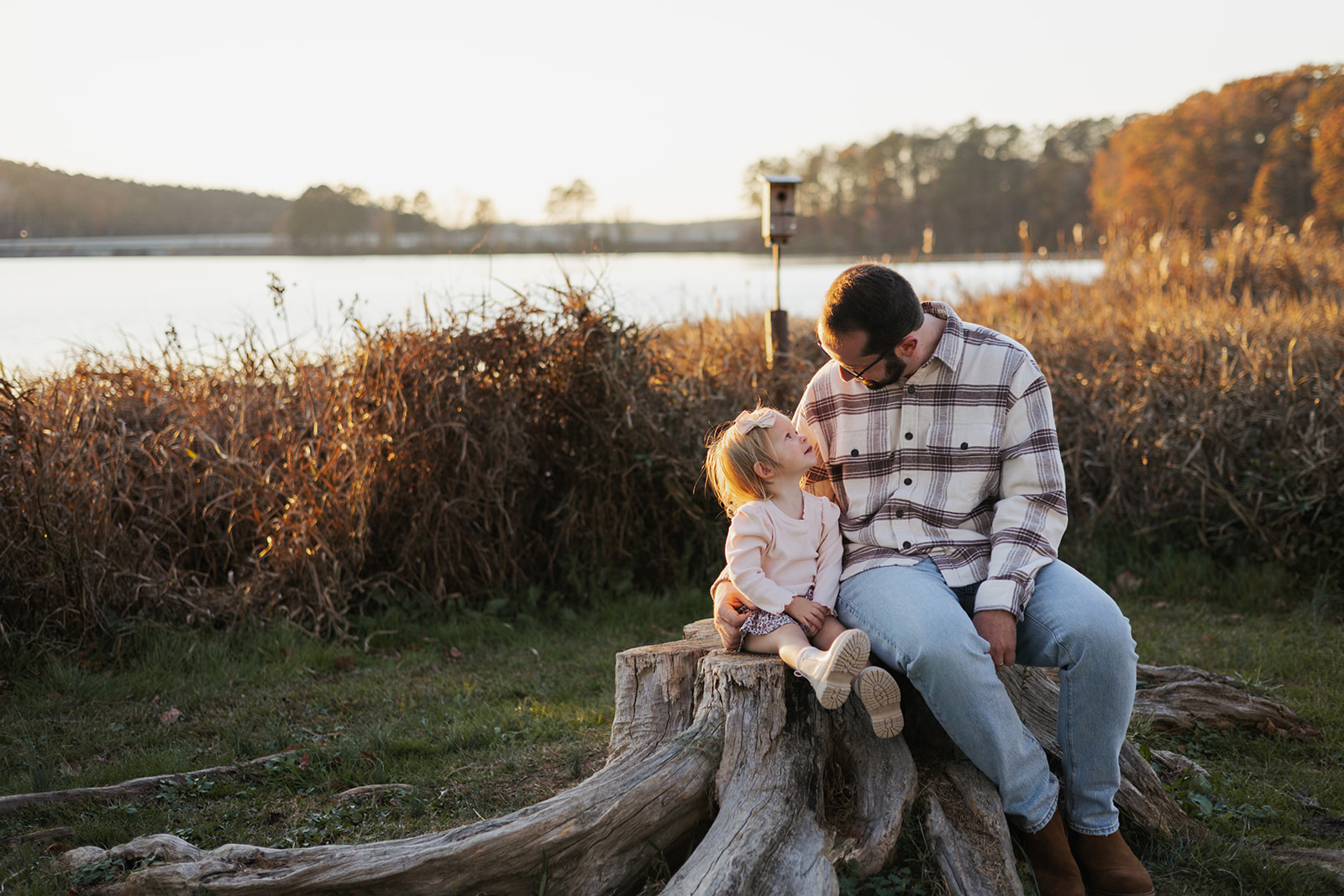 Dad and young daughter pose together during their Georgia family photoshoot