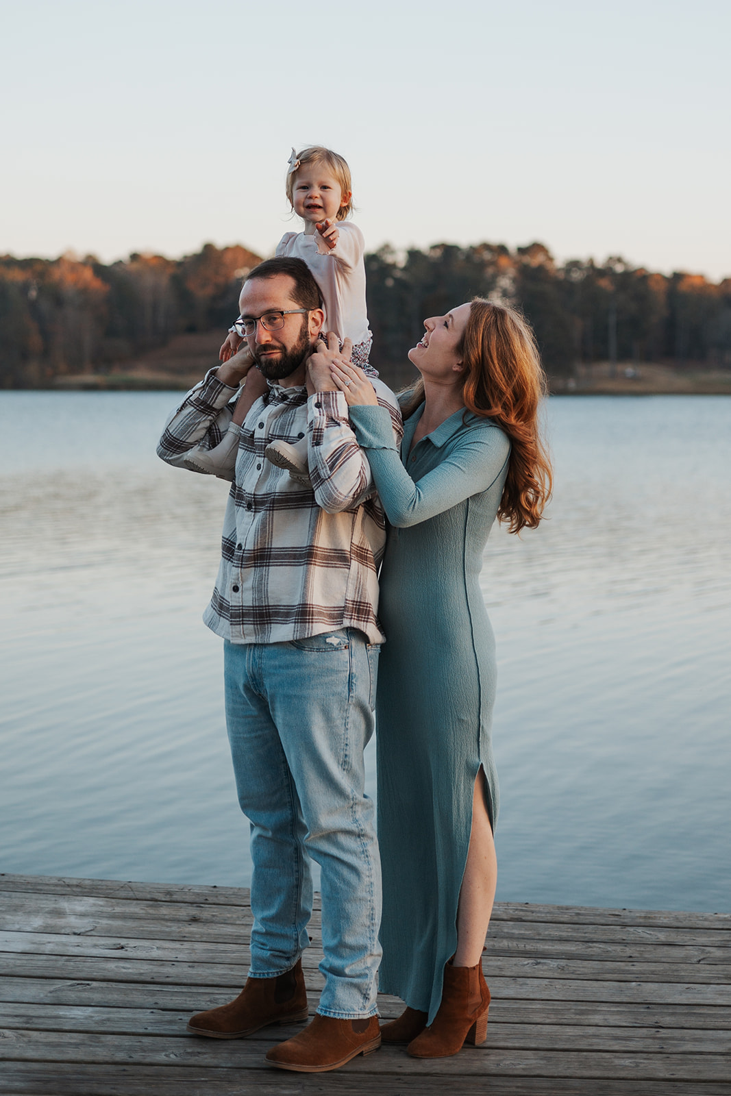 Stunning young family poses on a Georgia dock during their stress free family photos