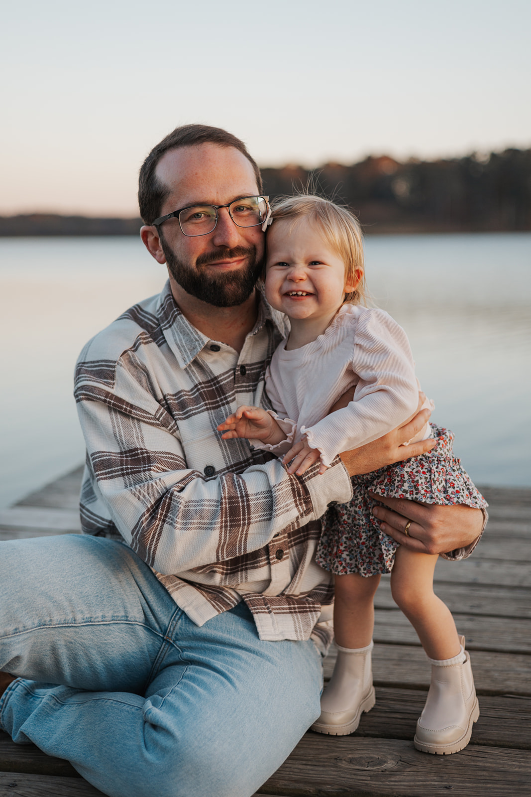 Dad and young daughter pose together during their Georgia family photoshoot