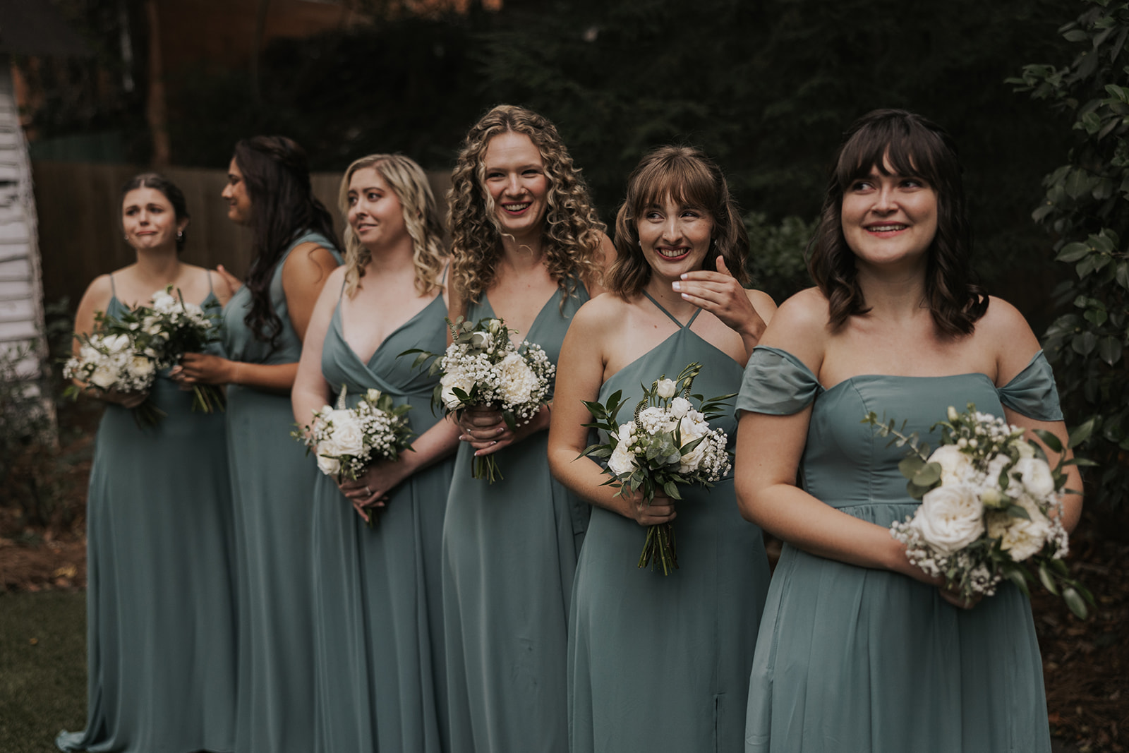 Bridemaids pose together at the alter before the dreamy Georgia wedding ceremony