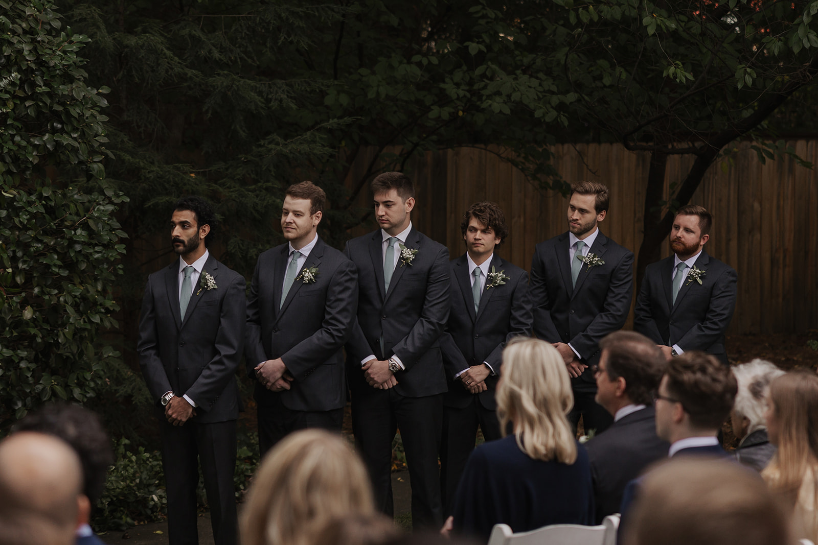 Groomsmen pose together at the alter before the dreamy Georgia wedding ceremony
