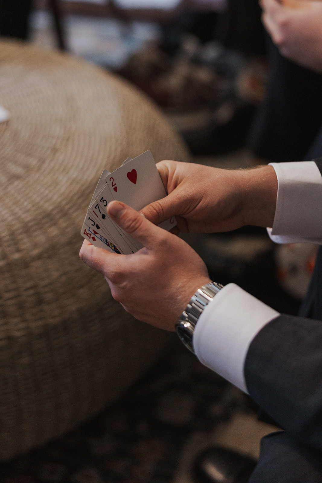 Groom and groomsmen play cards before the big wedding day