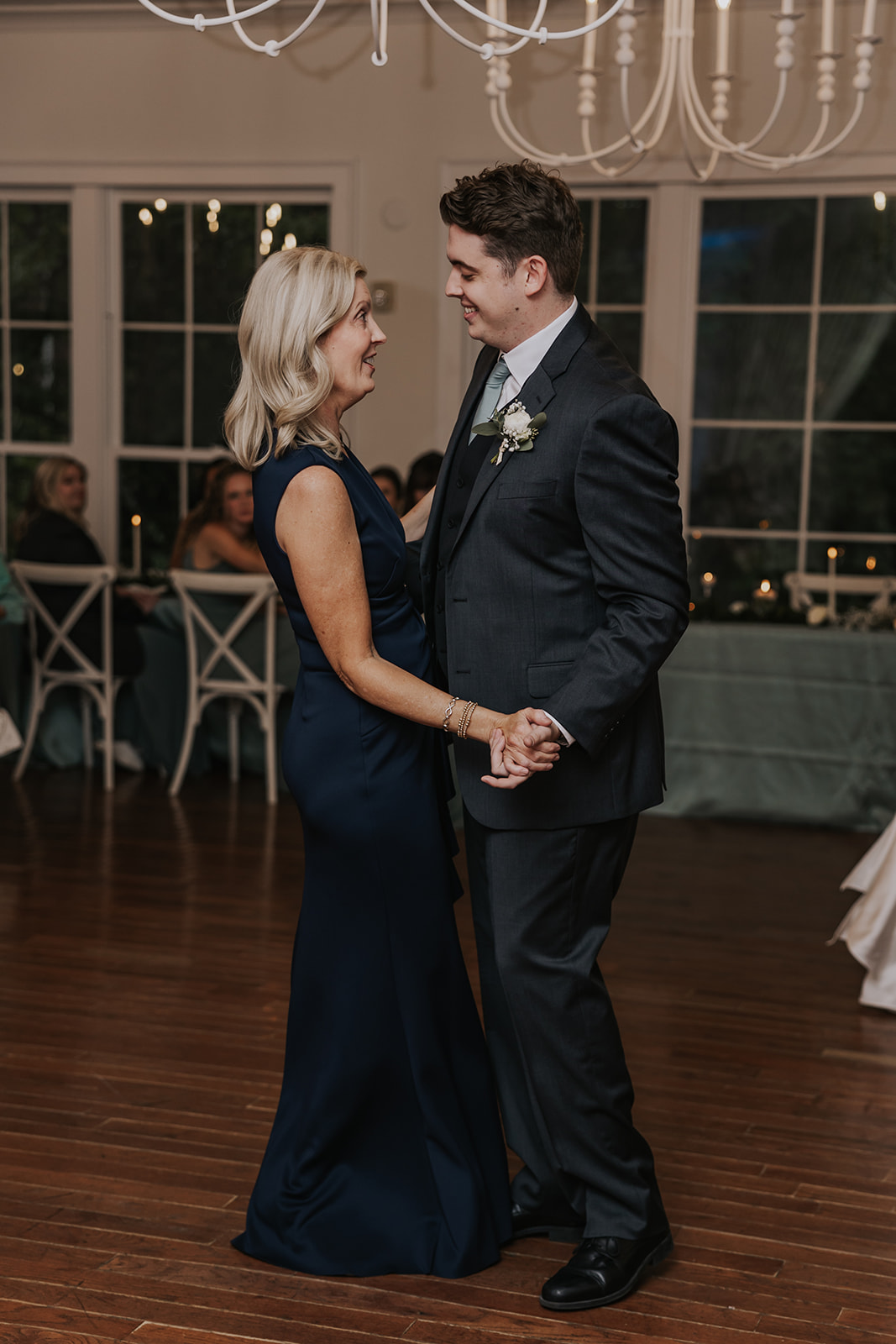Groom and his mom share a dance together