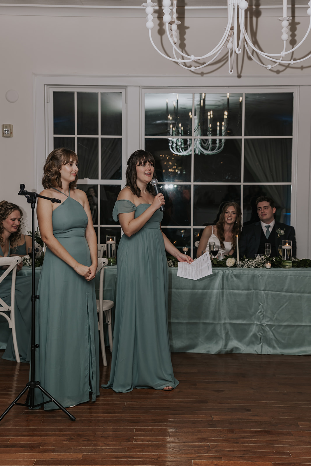Stunning bride and groom look on as their guests enjoy their dreamy Georgia wedding reception