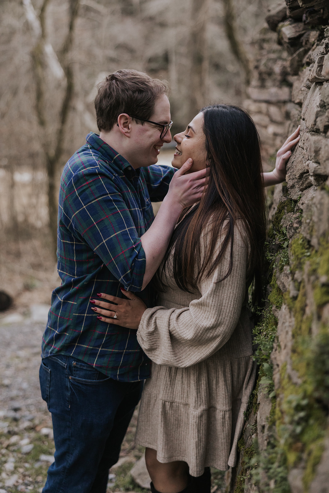 Beautiful couple pose beside the Roswell Mill Dam during their Roswell Mill engagement photos