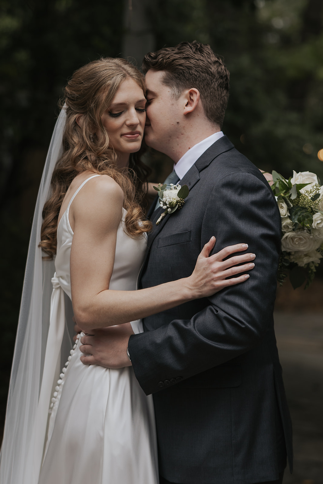 stunning bride and groom pose together after overcoming their share of wedding day disasters! 