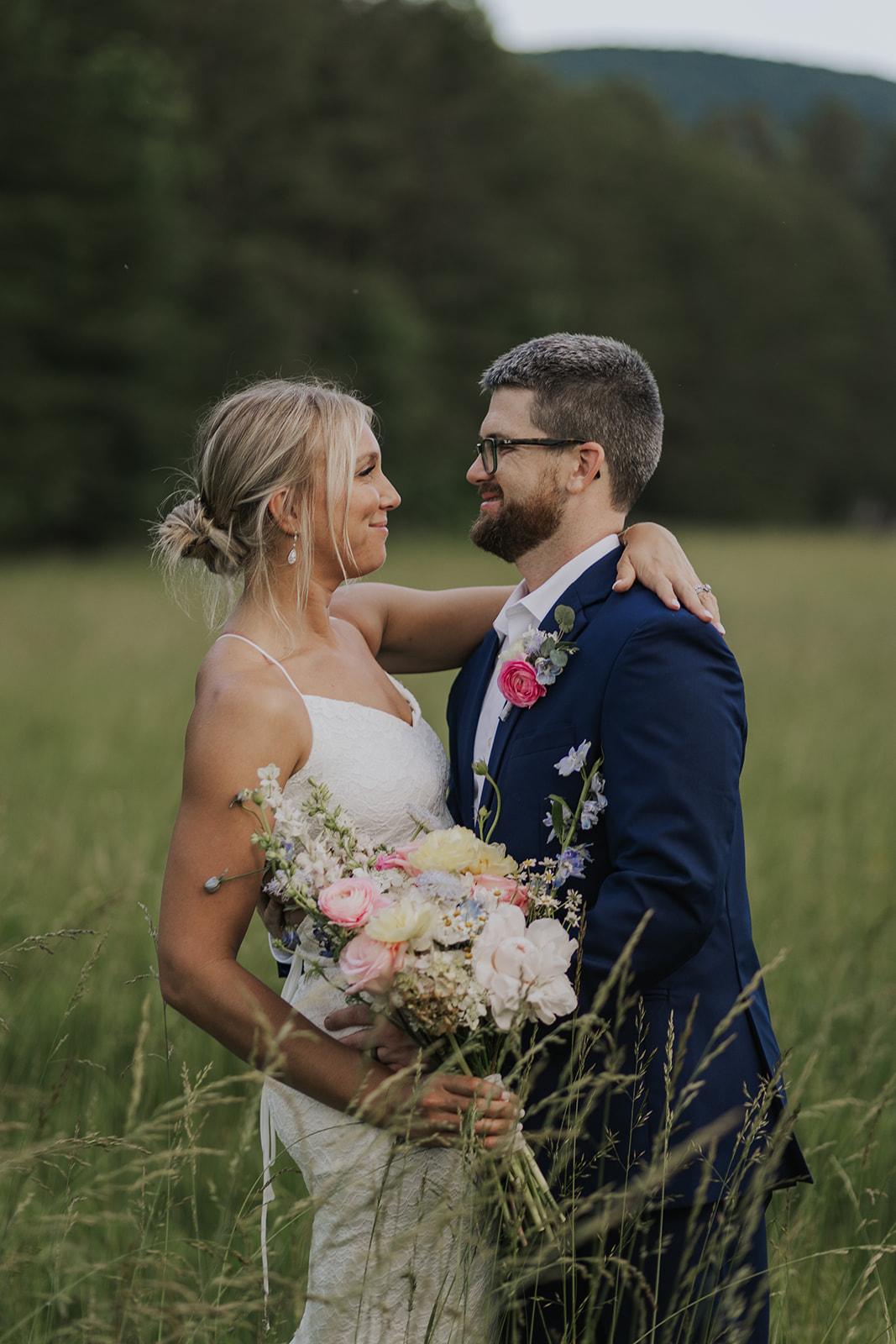 Stunning couple pose together in a wild Georgia field