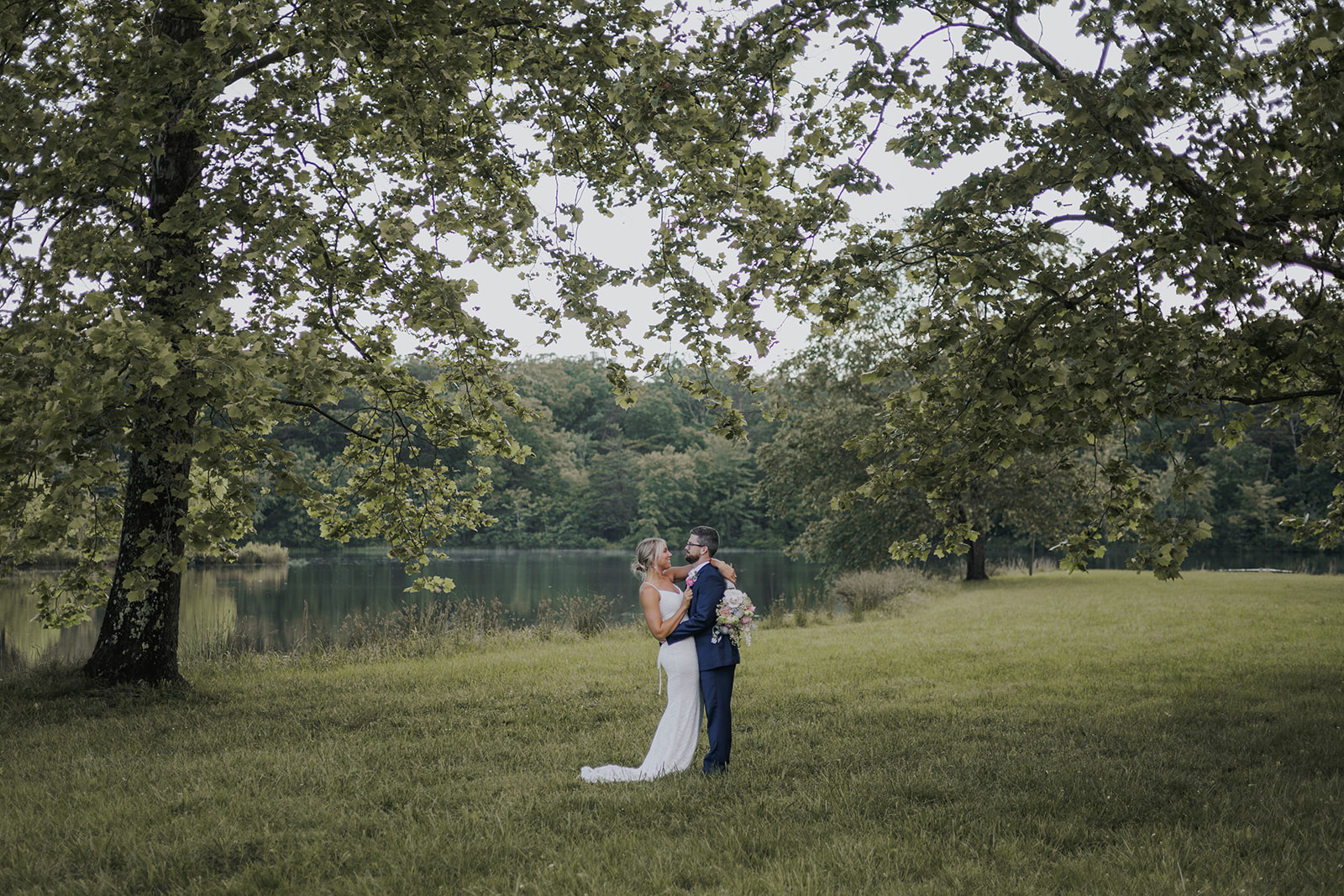 Stunning couple pose together in a wild Georgia field