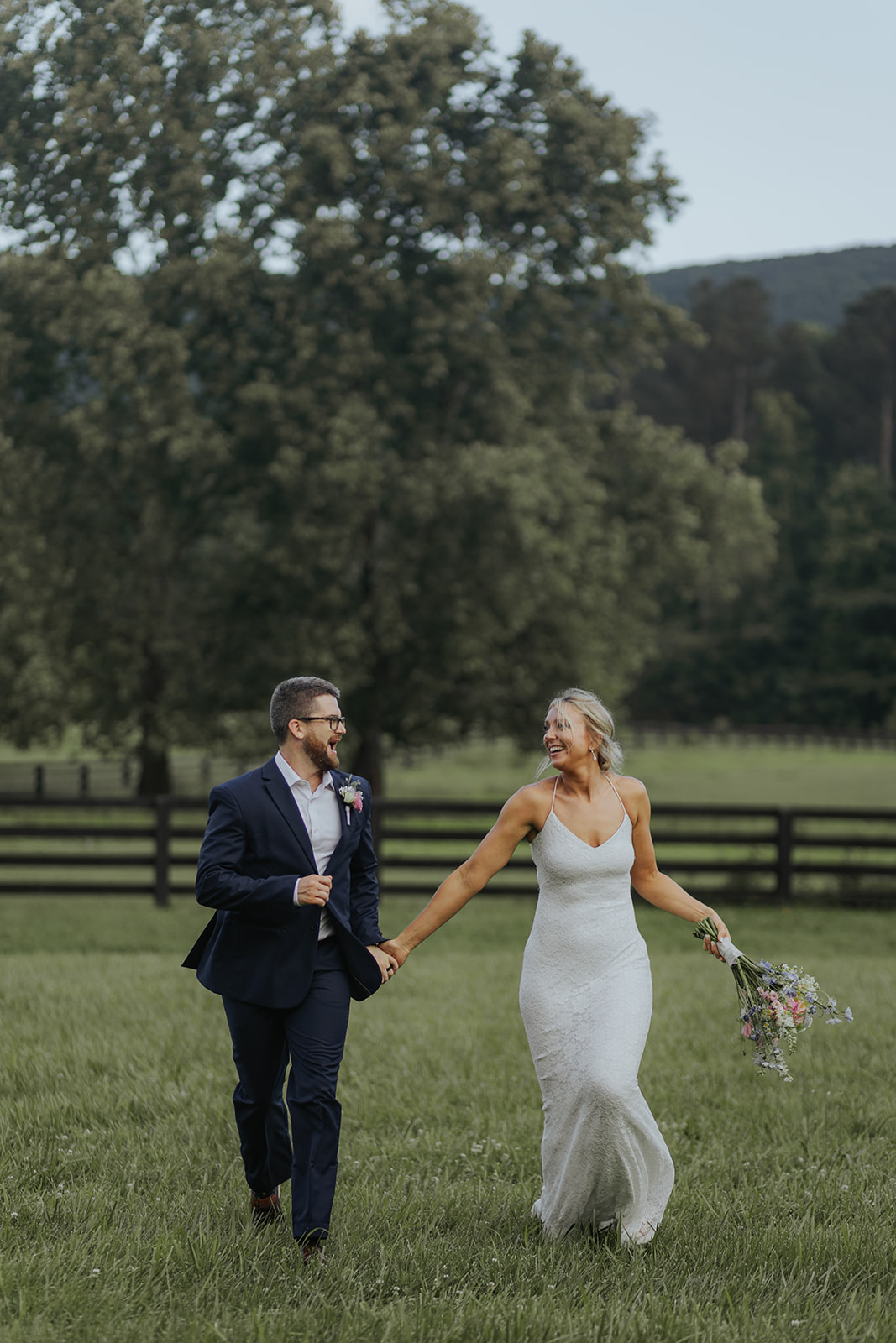 Stunning couple pose together in a wild Georgia field