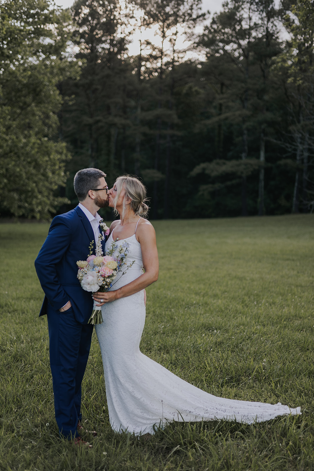 Stunning couple pose together in a wild Georgia field