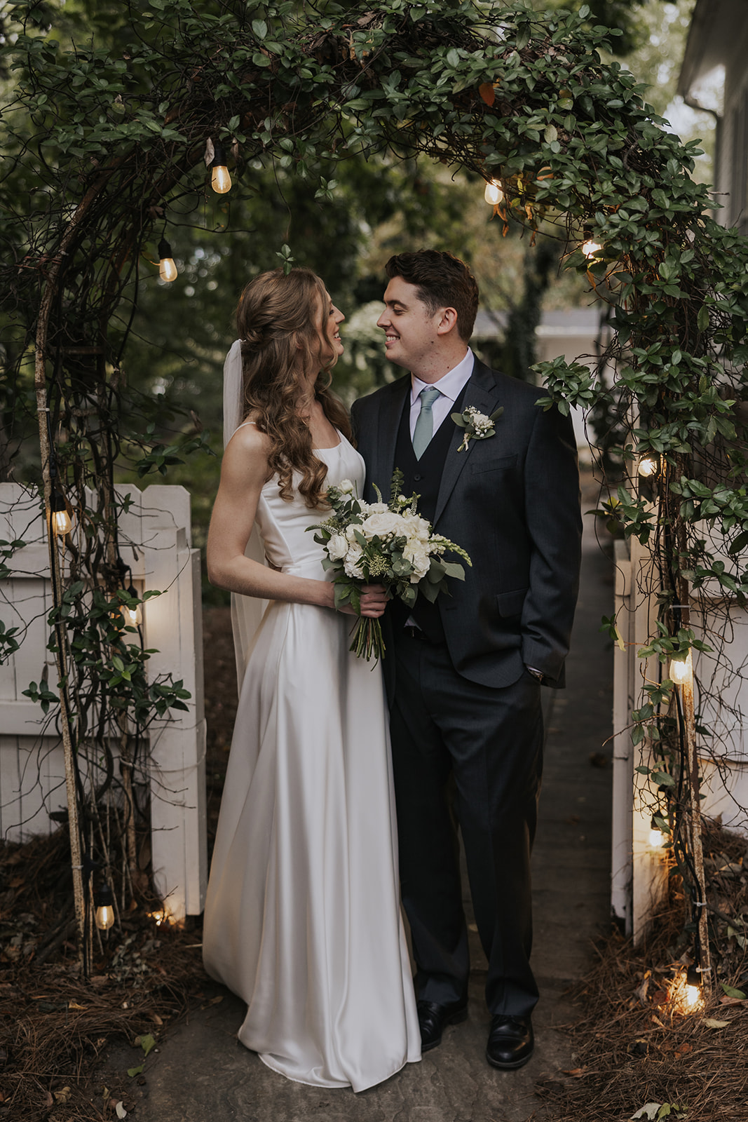 beautiful bride and groom pose after their dreamy wedding ceremony