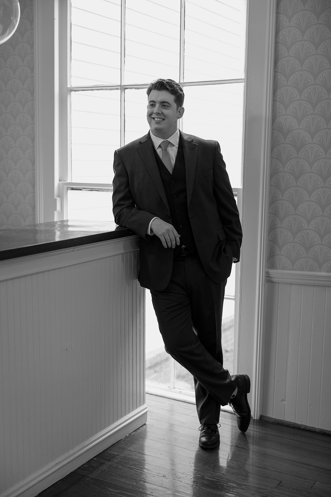 groom poses before his historic Georgia wedding