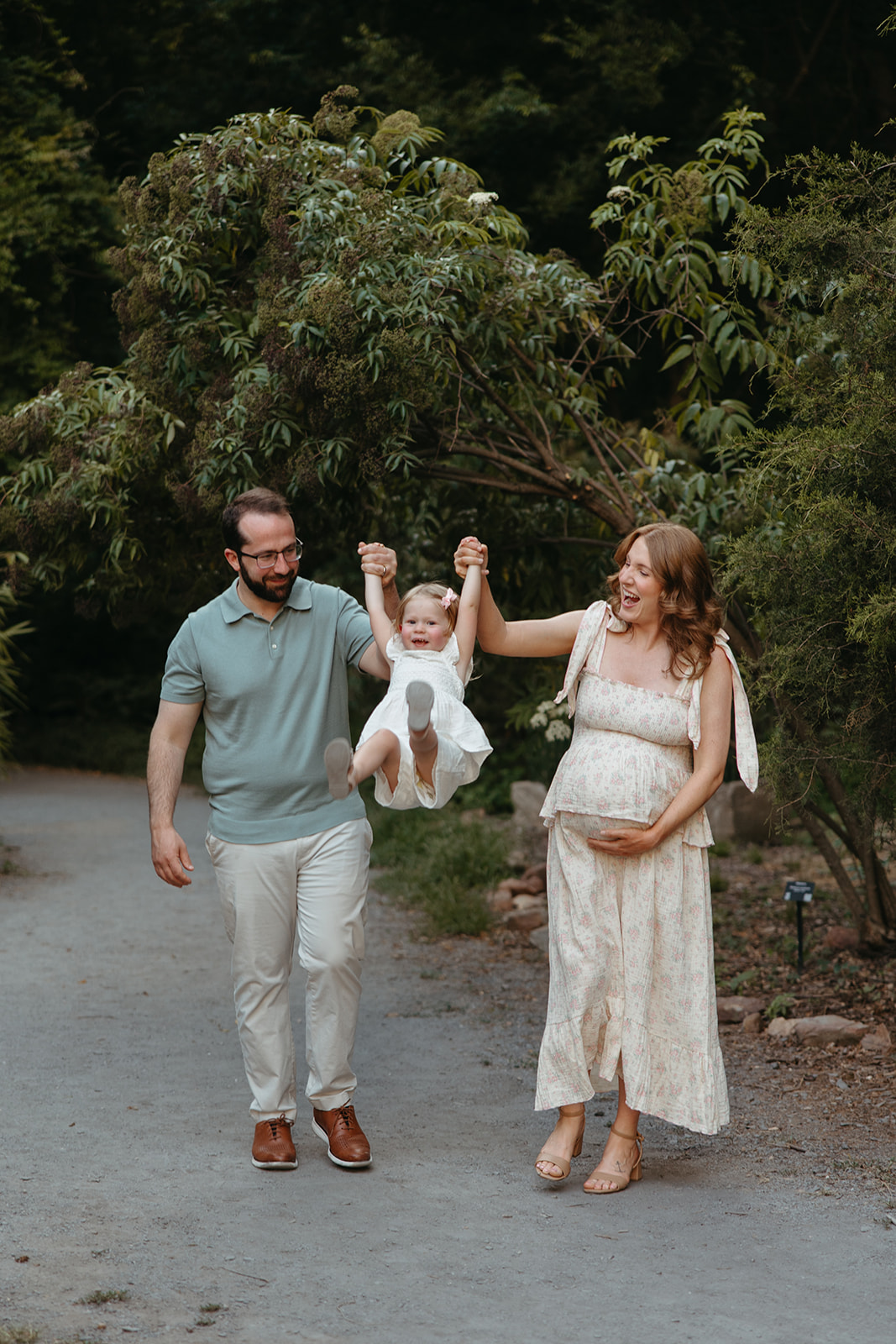 beautiful family poses together for their outdoor maternity photoshoot in Georgia