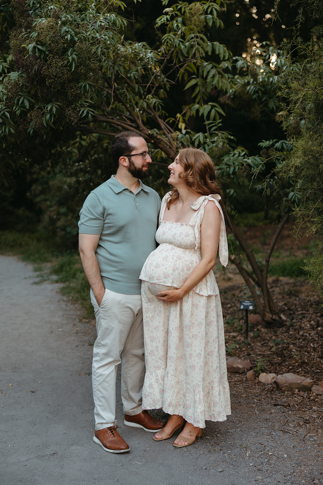 beautiful family poses together for their outdoor maternity photoshoot in Georgia