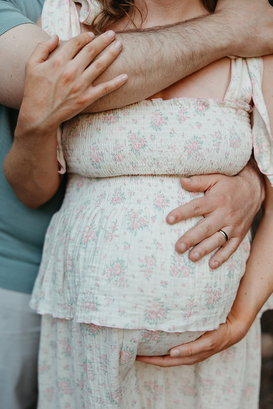 beautiful family poses together for their outdoor maternity photoshoot in Georgia