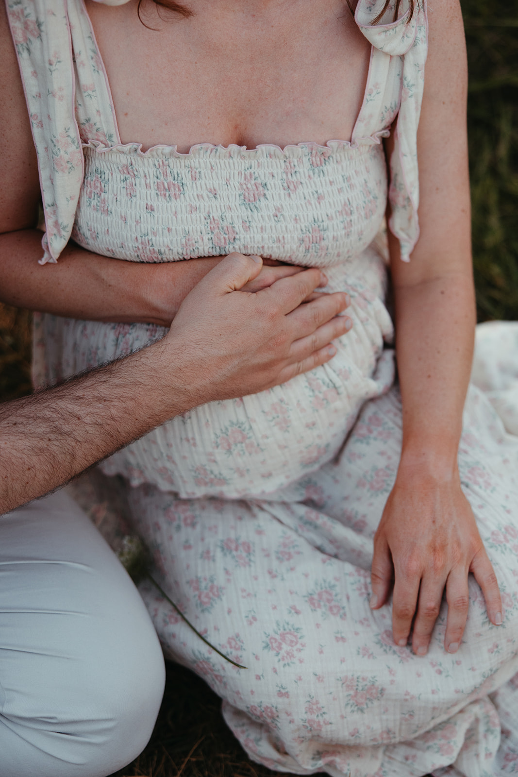 beautiful family poses together for their outdoor maternity photoshoot in Georgia