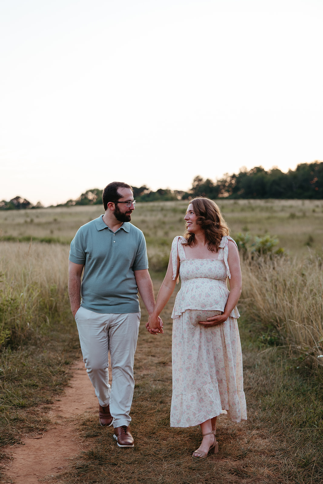 beautiful family poses together for their outdoor maternity photoshoot in Georgia