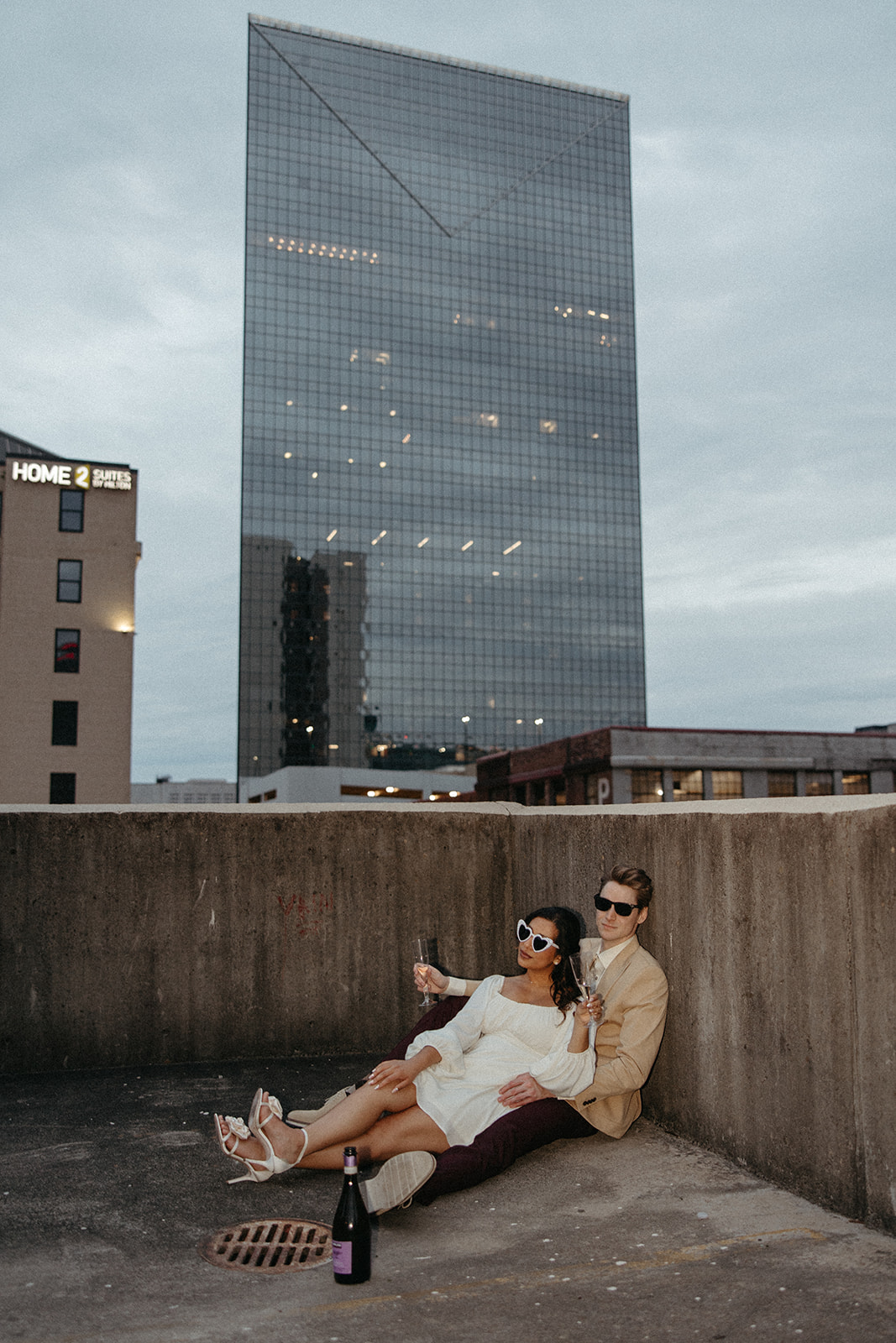 stunning couple pose together during their unique urban engagement photoshoot