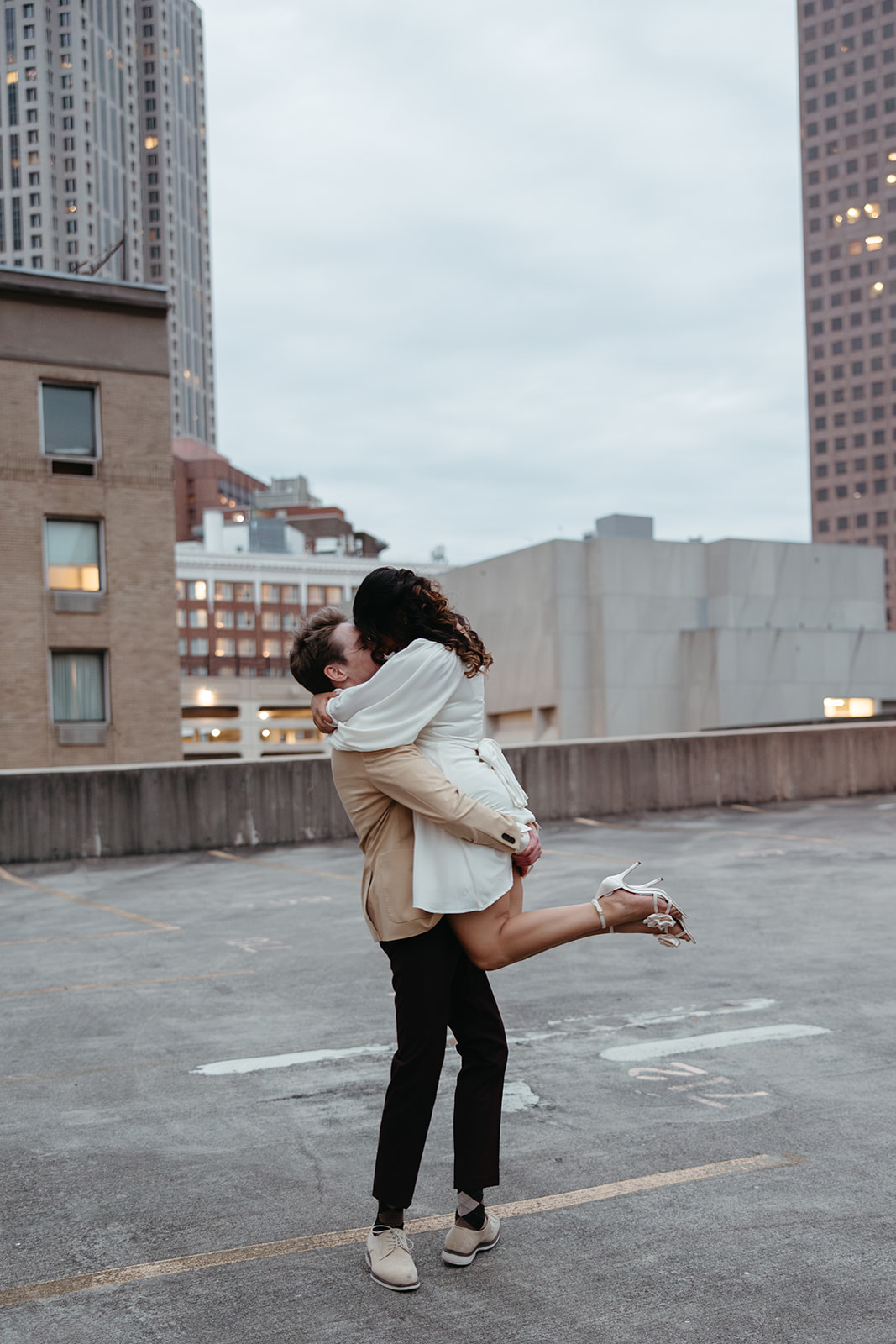 stunning couple pose together during their unique urban engagement photoshoot