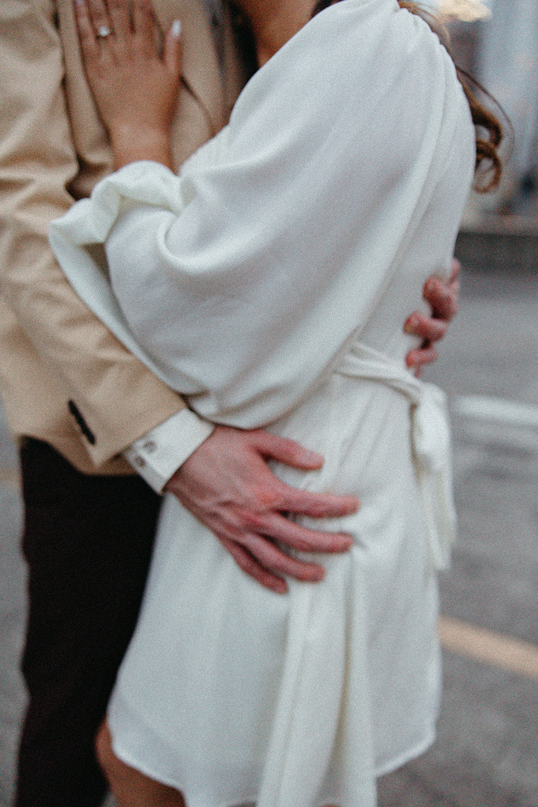 stunning couple pose together on an Atlanta parking garage during their Georgia engagement photoshoot