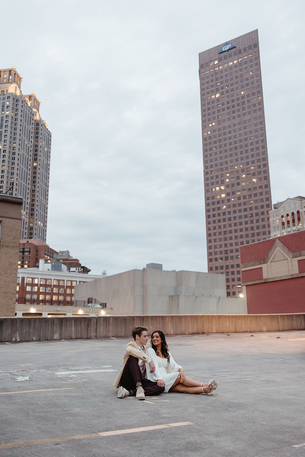 stunning couple pose together during their unique urban engagement photoshoot