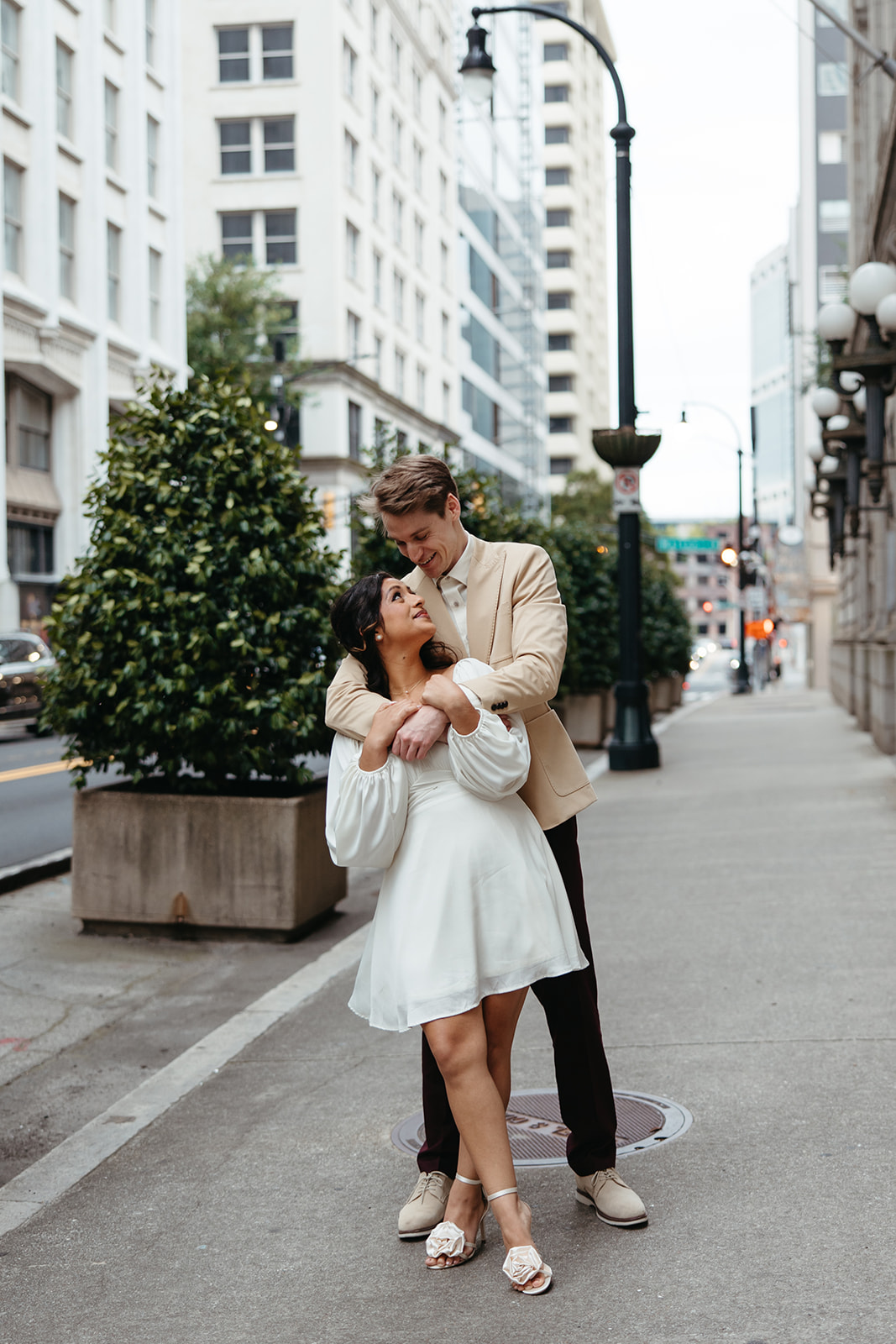 beautiful couple walk the streets of Atlanta during their Georgia engagement photos