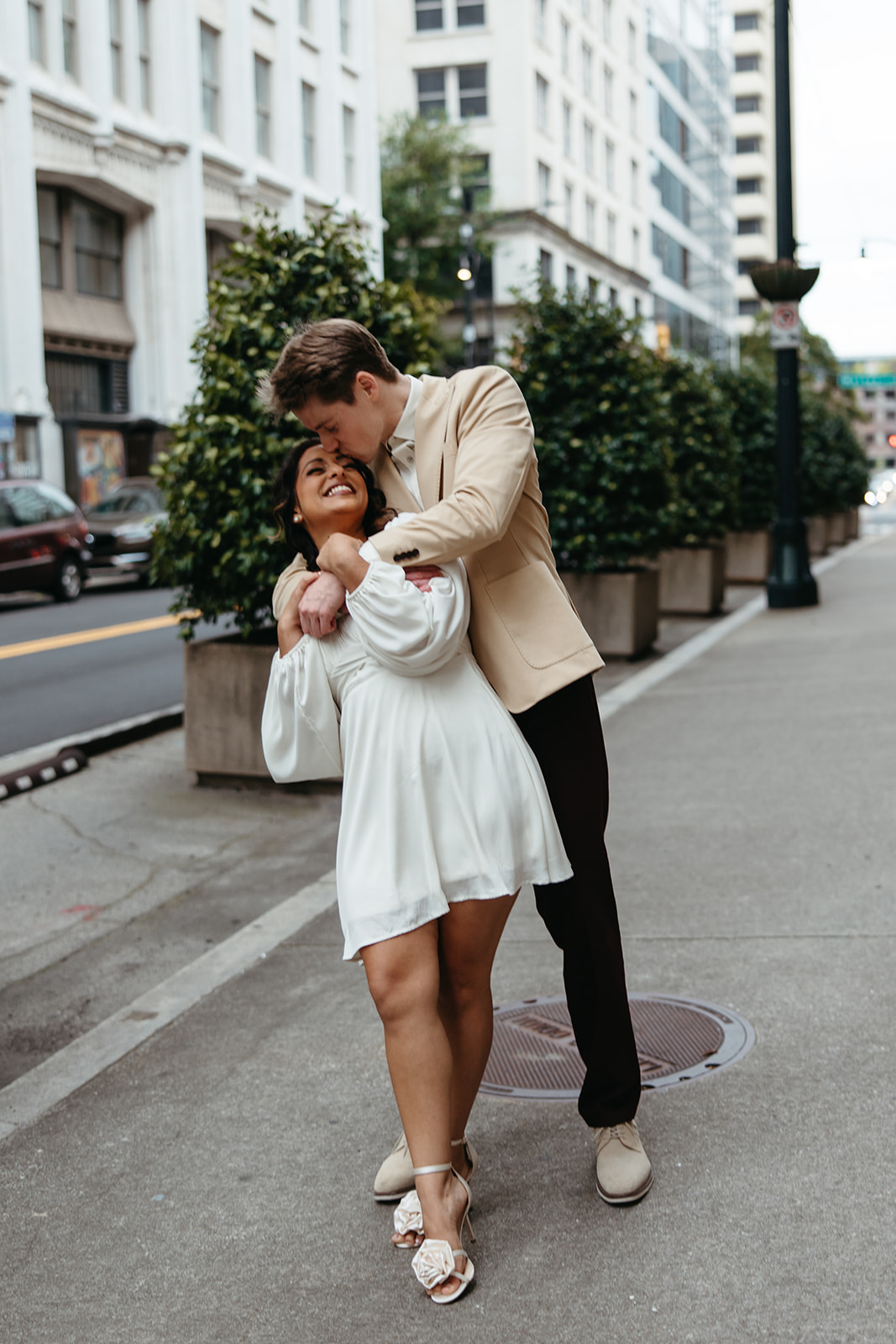 beautiful couple walk the streets of Atlanta during their Georgia engagement photos