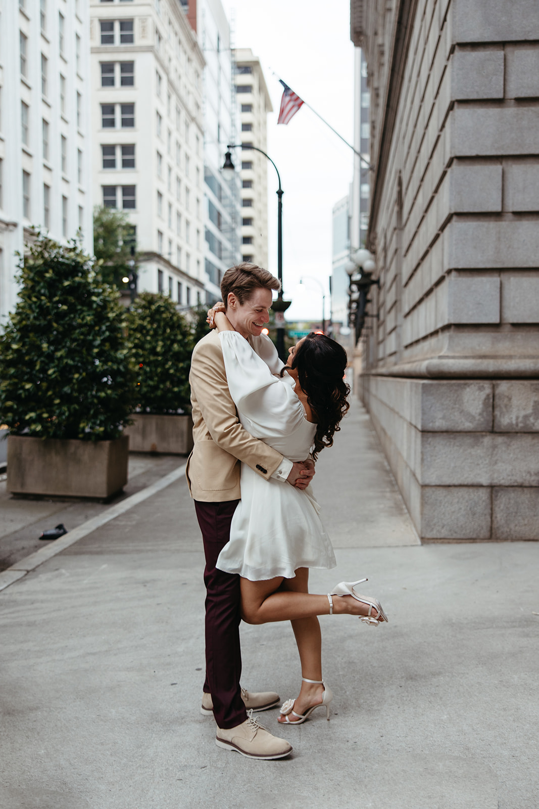 beautiful couple walk the streets of Atlanta during their Georgia engagement photos