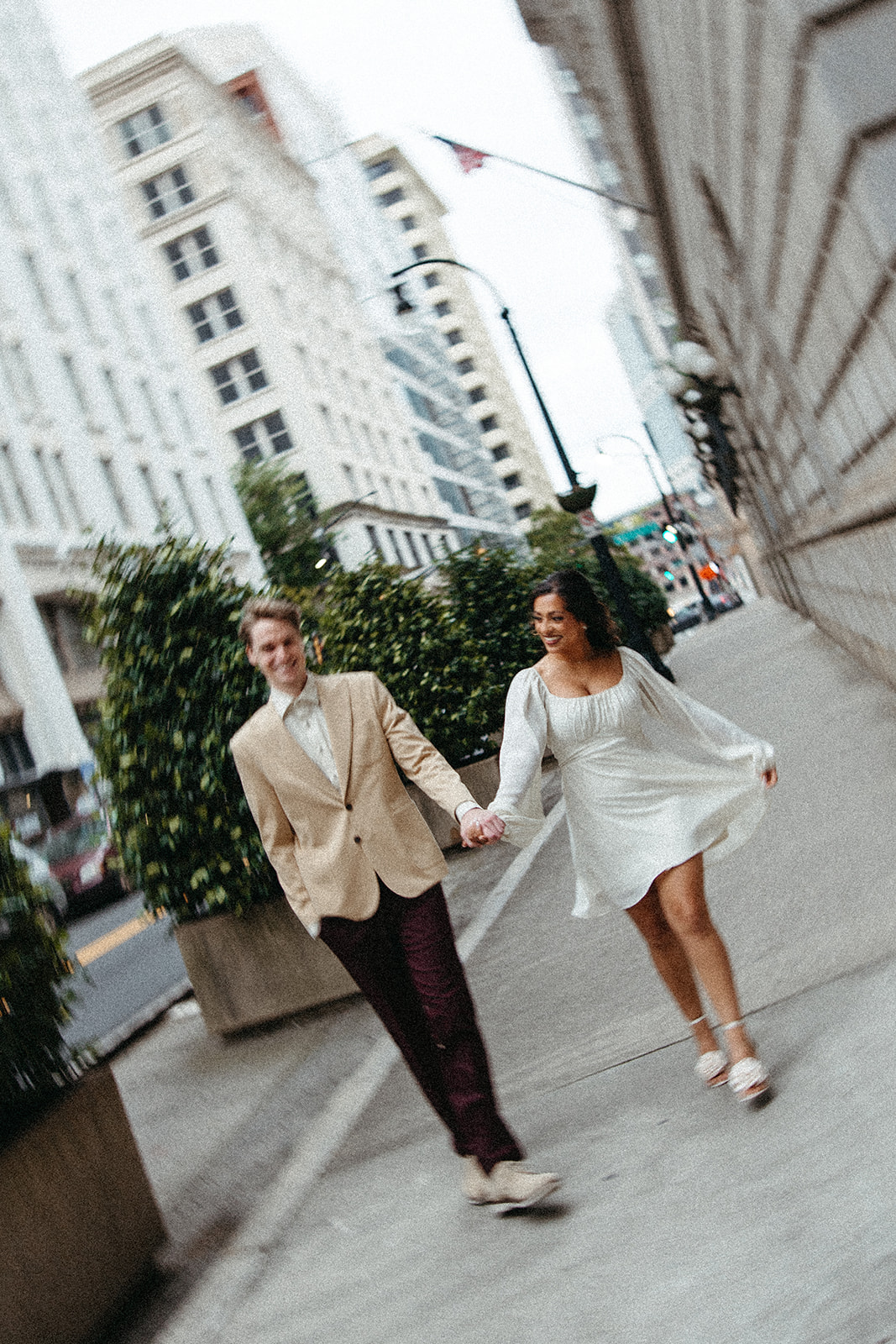 beautiful couple walk the streets of Atlanta during their Georgia engagement photos