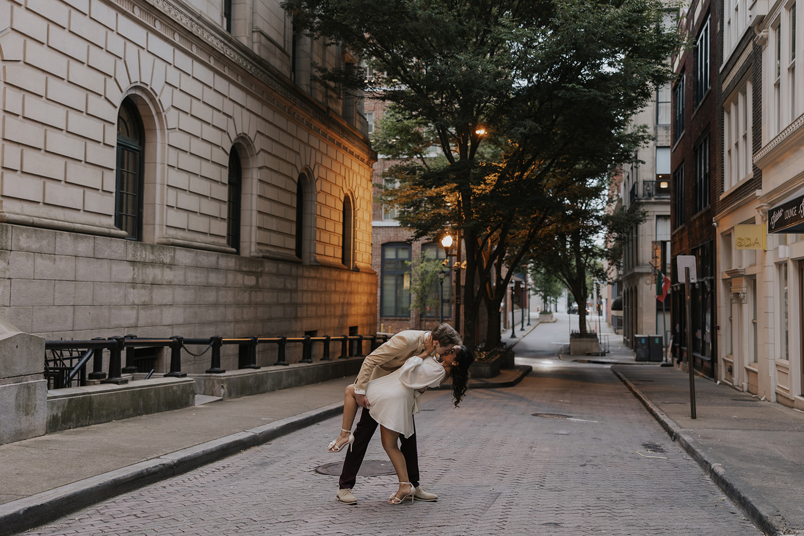 beautiful couple walk the streets of Atlanta during their Georgia engagement photos