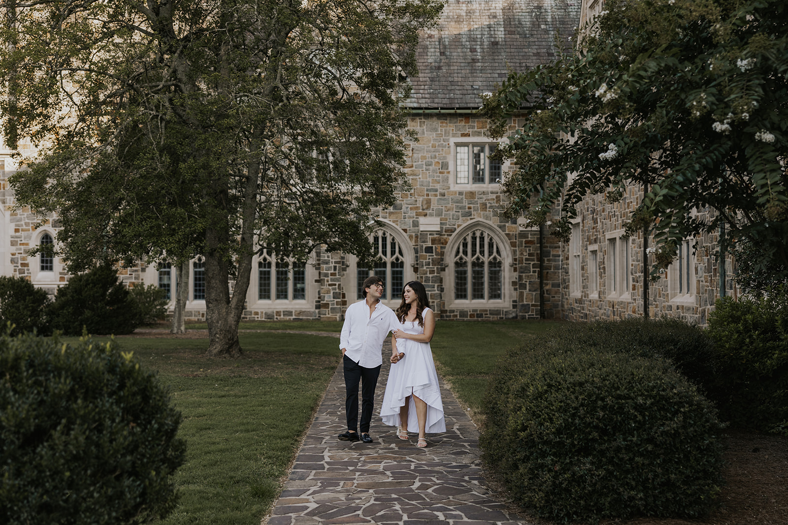 stunning couple pose together during their Berry college engagement photoshoot