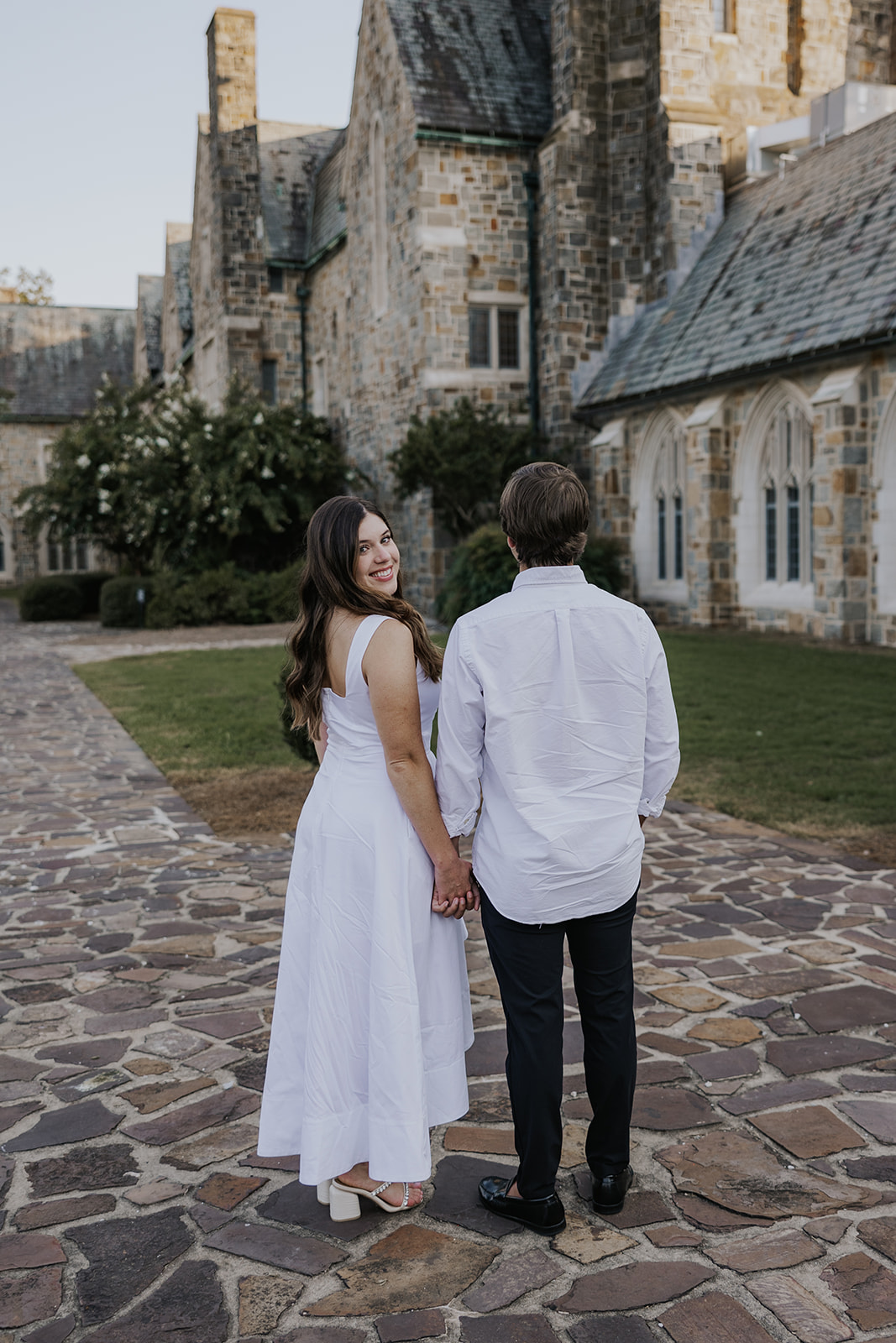 stunning couple pose together during their Berry college engagement photoshoot