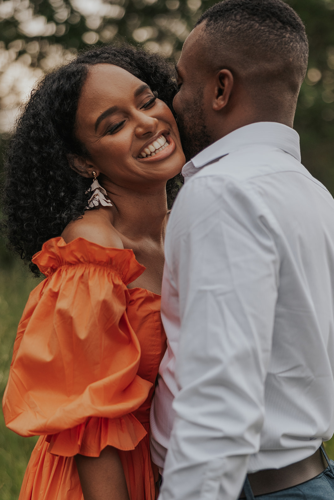 beautiful couple stands in a Georgia field together during their mini session