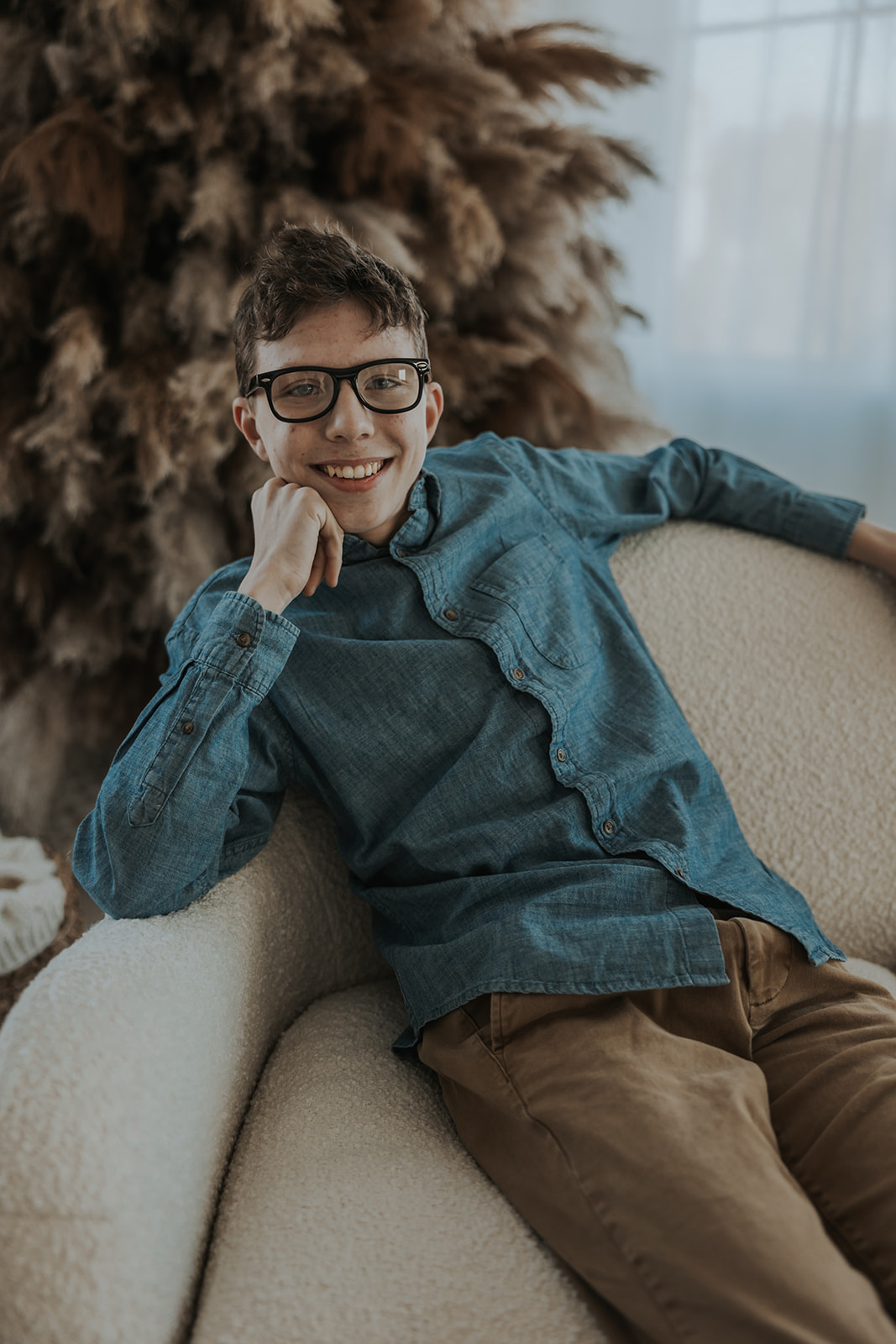 child poses during their Family Photos in a Studio