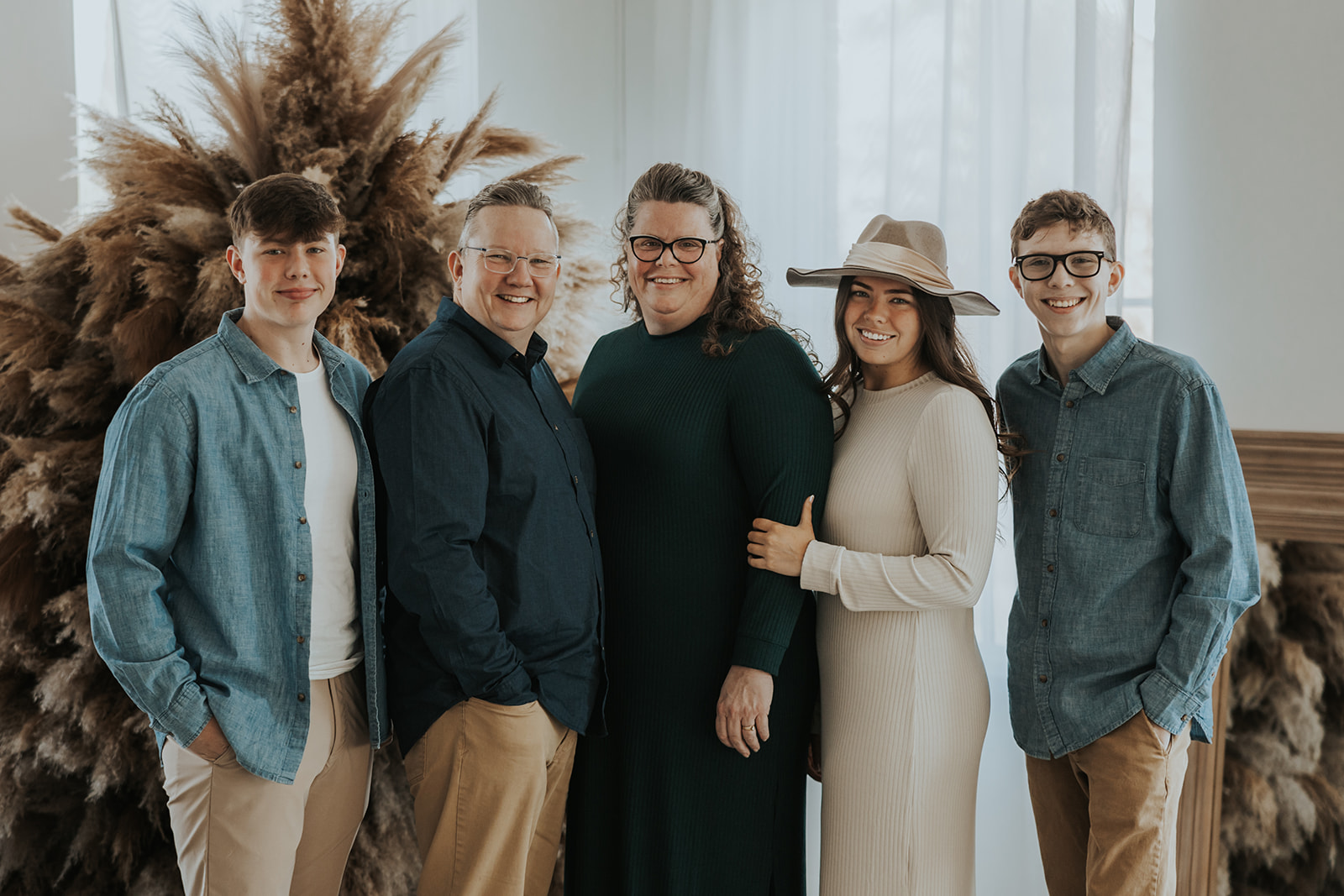 beautiful family pose together during their Family Photos in a Studio