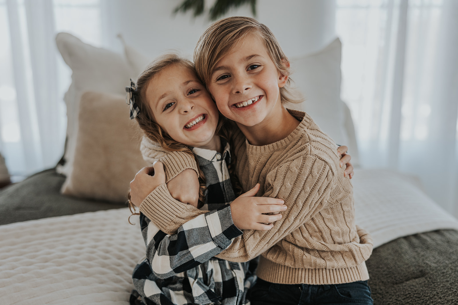 Brother and sister poses during their Family Photos in a Studio