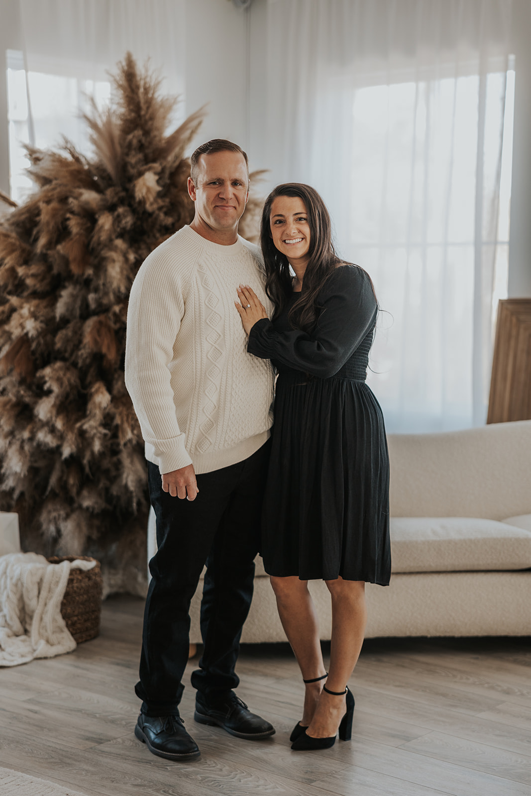 beautiful couple pose together during their in home photoshoot