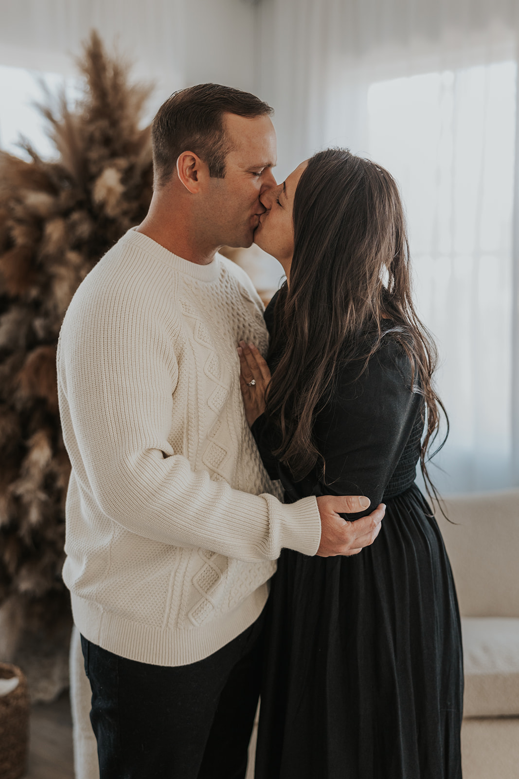 beautiful couple pose together during their in home photoshoot